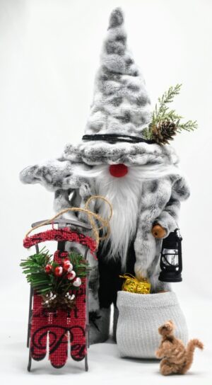 Handmade Woodland Santa Gnome in gray faux fur coat with pinecone hat, holding sled and lantern, beside gift sack and small woodland squirrel