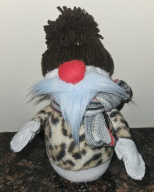 Handmade snowman gnome with blue beard, red nose, leopard-print sweater, brown yarn hat, and knit scarf.