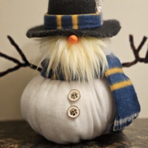 Bill Chill 9 inch handmade snowman gnome wearing black top hat, blue and yellow striped scarf, orange carrot nose, white beard, and clover buttons on white felt body
