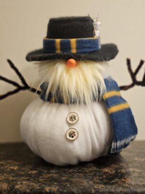 Bill Chill 9 inch handmade snowman gnome wearing black top hat, blue and yellow striped scarf, orange carrot nose, white beard, and clover buttons on white felt body