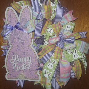 Large 24x22 handmade Happy Easter bunny wreath with lavender bunny sign, pastel ribbons, plaid and striped accents, and spring mesh on a front door.