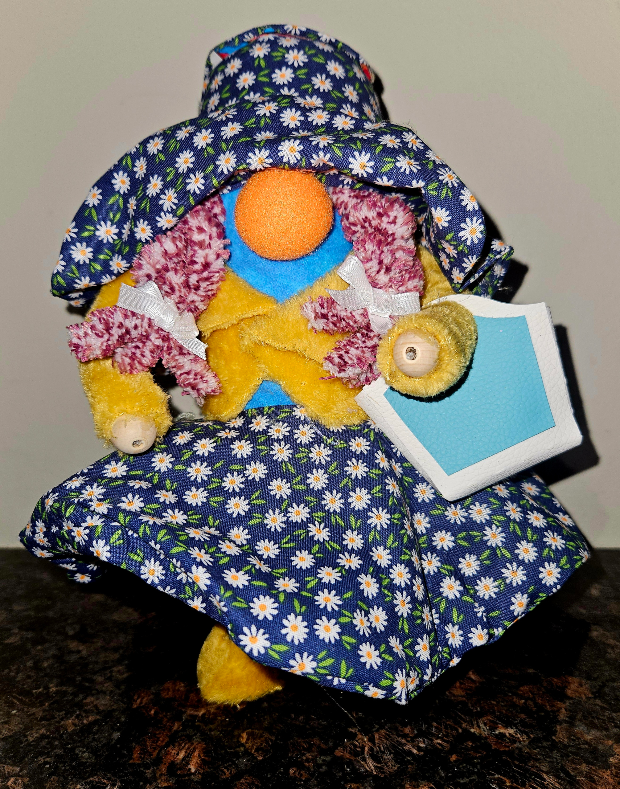 Handmade Matilda floral lady gnome in daisy dress and large matching bonnet holding a tote by Metamorphosis by Babs