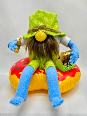 Handmade beer gnome relaxing in donut pool float with beer bottles, detailed summer party gnome decor