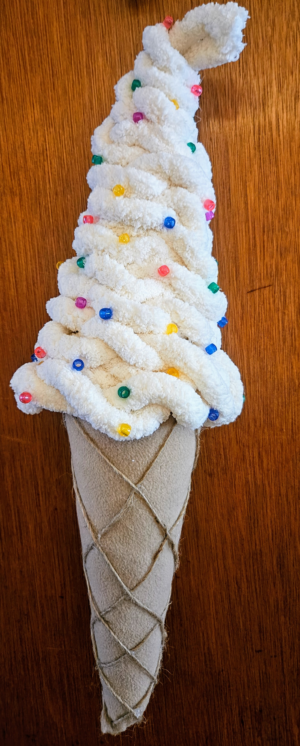 Handmade 22.5 inch vanilla ice cream cone door hanging with rainbow sprinkles by Metamorphosis by Babs