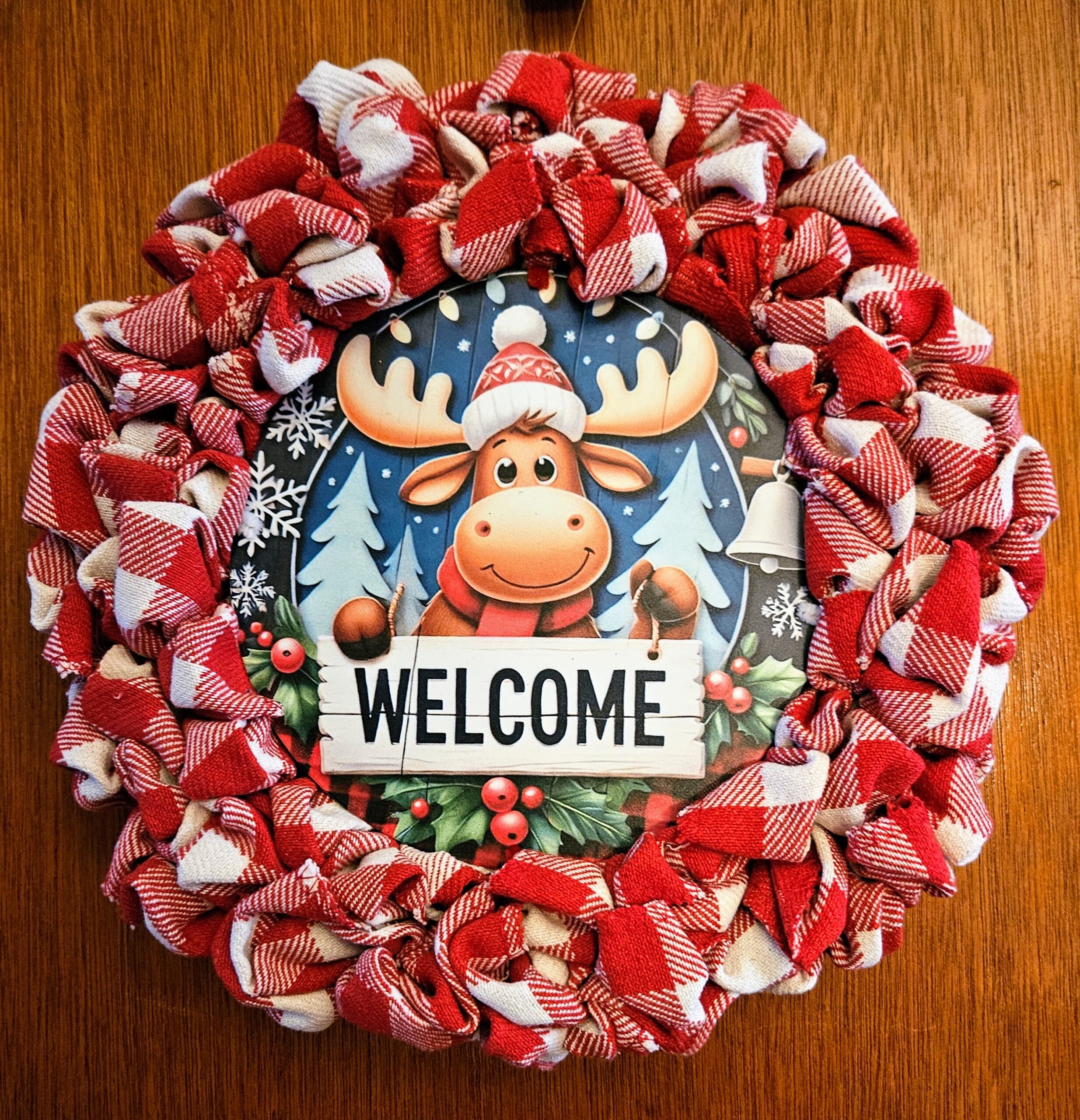 Winter moose wreath with red and white plaid ribbon, Christmas moose sign, and Welcome sign